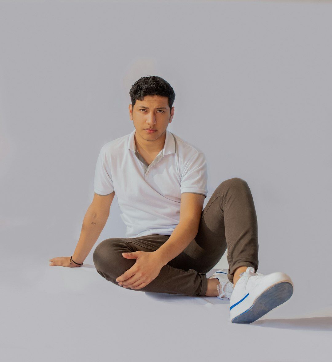 Studio portrait of a young Latino man photographer